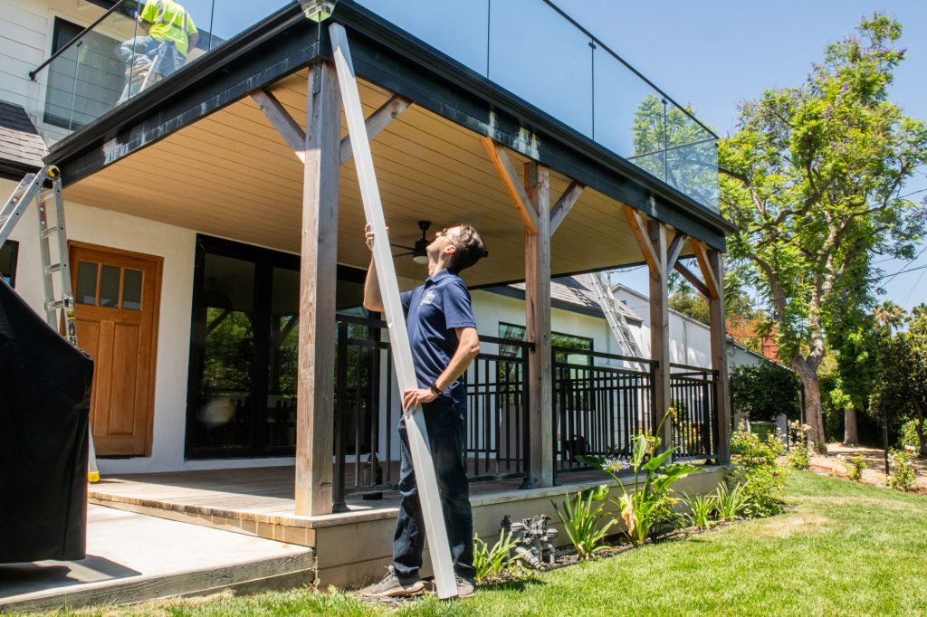 Seamless gutter run being fitted on a Los Angeles home
