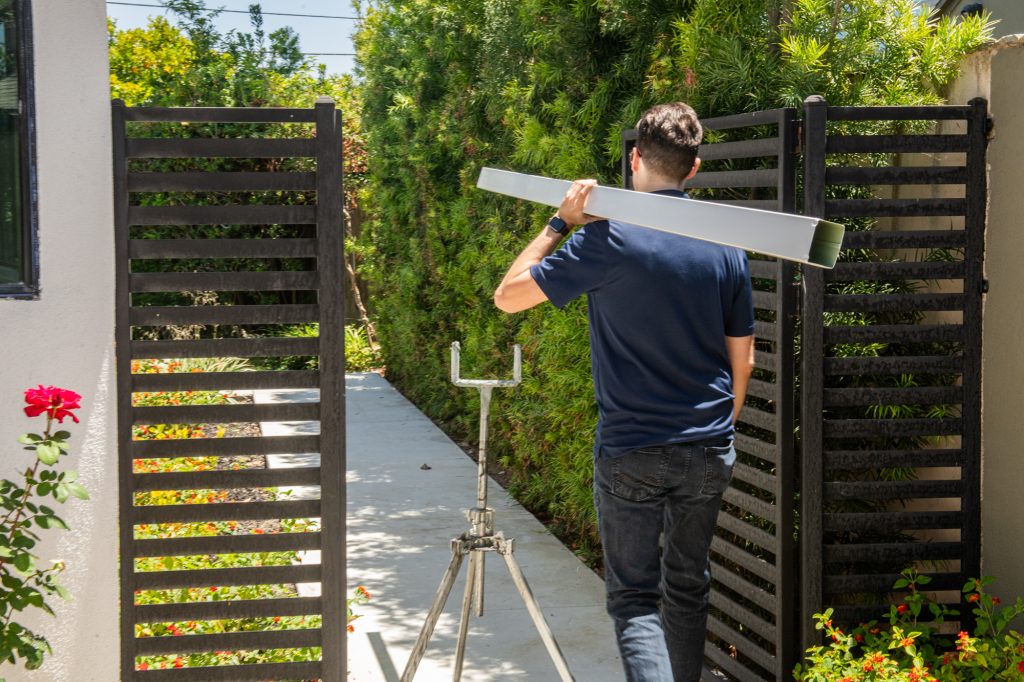 Solutionist carrying a seamless gutter run into a coastal property