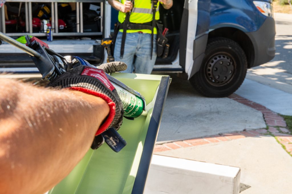 Seamless gutter run being fitted on a Los Angeles home