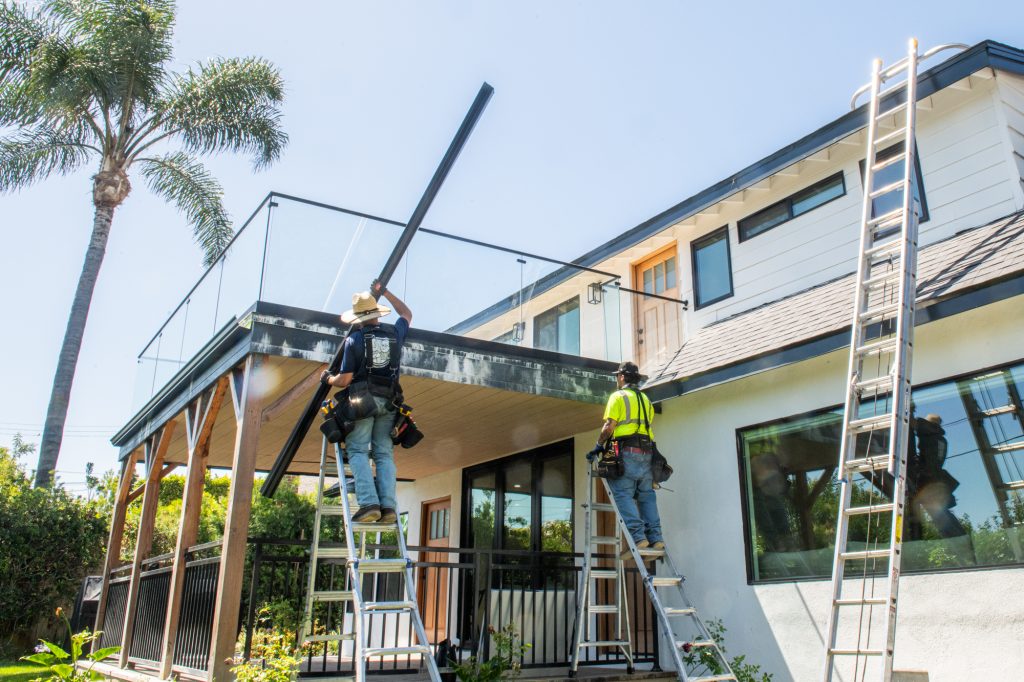 Seamless gutter run being fitted on a Los Angeles home