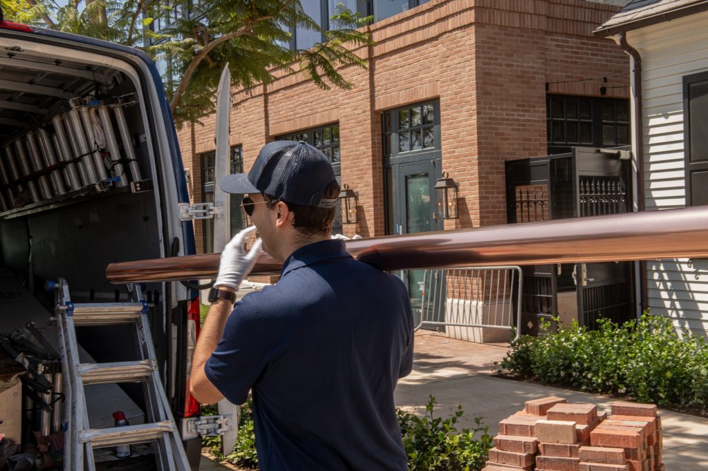 Seamless gutter run being fitted on a Los Angeles home