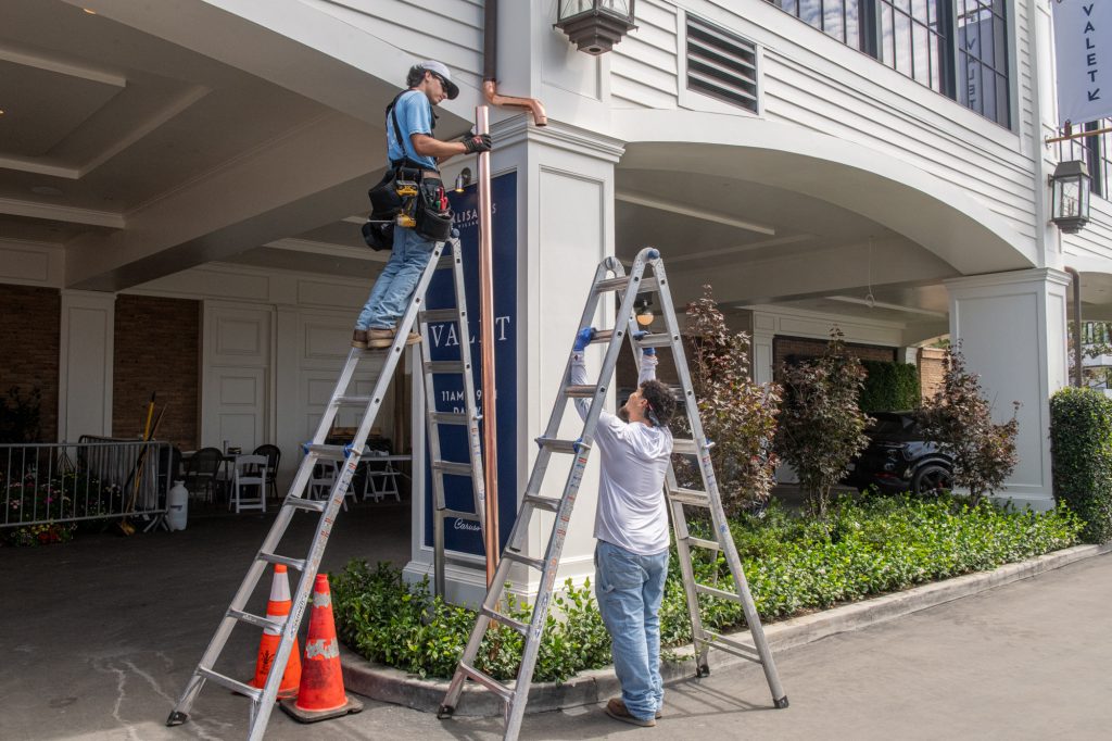 The Brothers That Just Do Gutters crew on a Los Angeles job