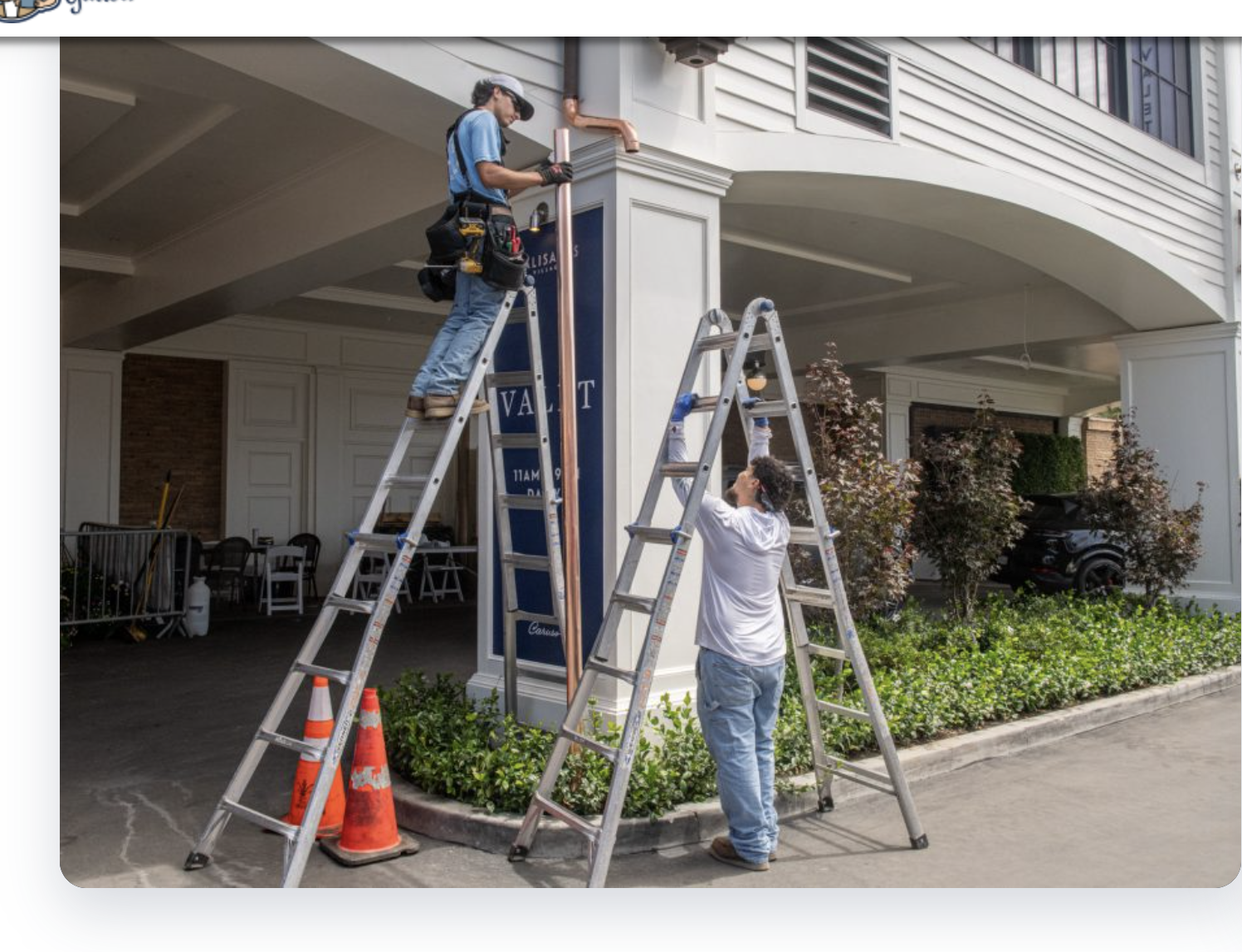 Brothers That Just Do Gutters crew installing a copper downspout at a Caruso commercial property in Los Angeles